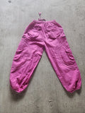 All pink BubbleJawnZ handmade cotton festival pants with a stash pocket