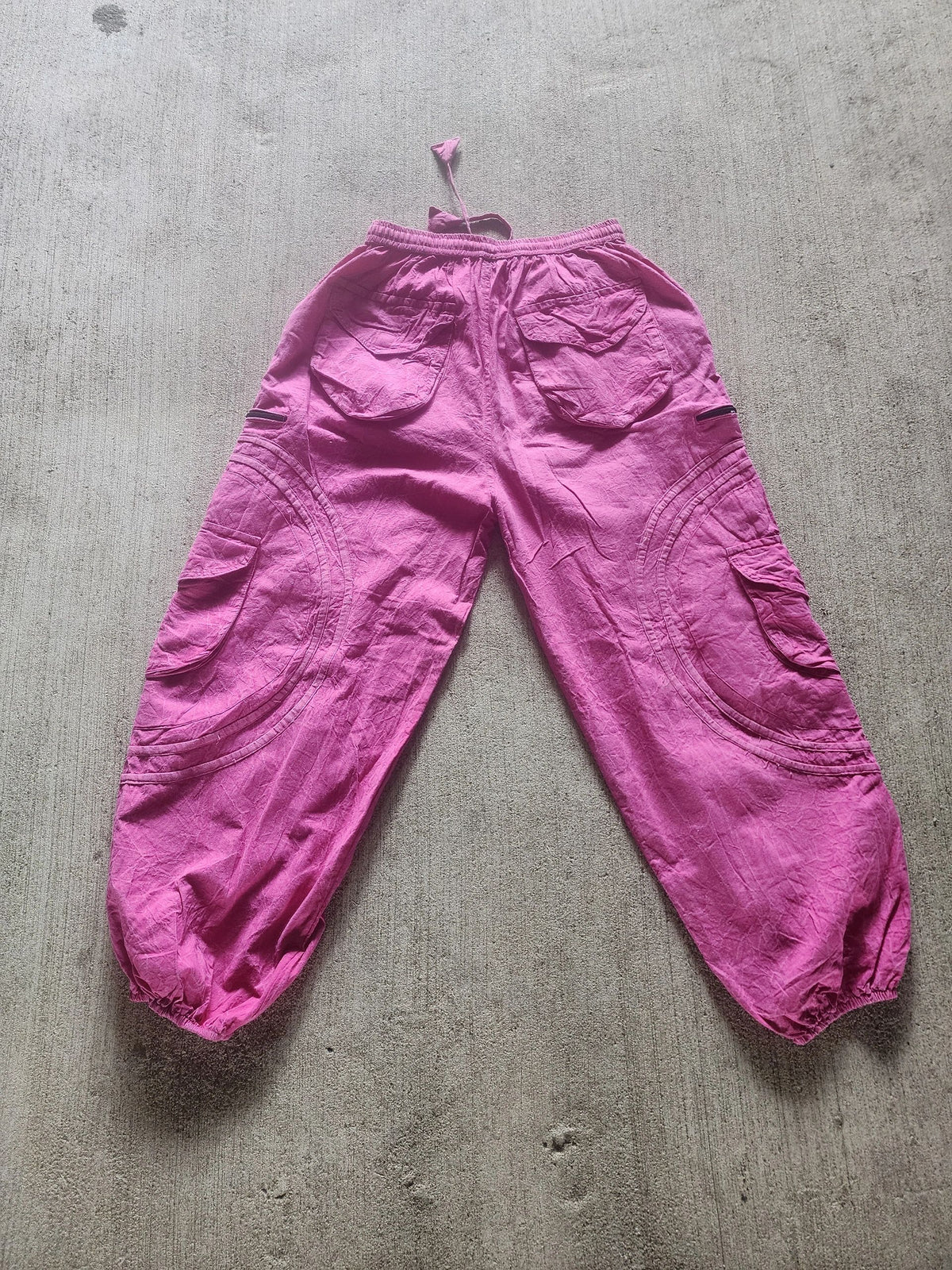 All pink BubbleJawnZ handmade cotton festival pants with a stash pocket