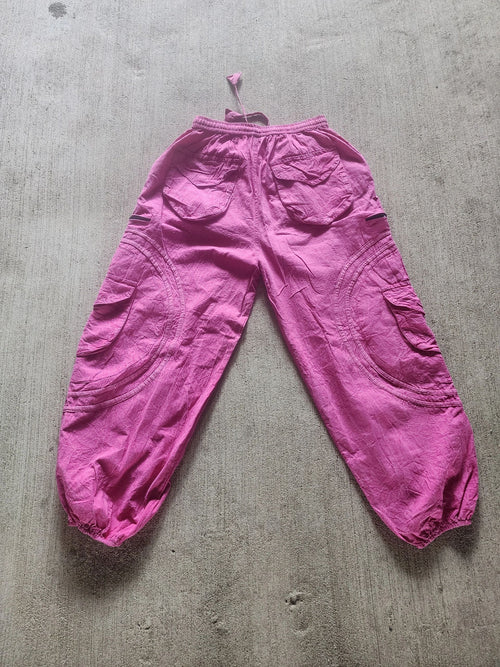 All pink BubbleJawnZ handmade cotton festival pants with a stash pocket